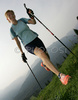 Nordic walker is enjoying her sport on slopes above Bohinj, Slovenia. Nordic walking was first used as a summer training method by cross-country skiers. Nordic walking is one of the fastest growing recreational fitness sports in the world. Nordic walking is fitness walking with specially designed nordic walker poles and offers a very efficient, aerobic and easy way to improve your physical condition irrespective of age, sex or physical condition.
