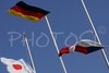 Flags of Germany, Japan and Czech are flying in the air in honor of winner Tom Beetz of Germany, second placed Akito Watabe of Japan and third placed Miroslav Dvorak of Czech during medal ceremony for Junior Nordic combined sprint race of FIS Nordic Junior Ski World Championships which was held in Medvode, Slovenia on 5.February 2006.
