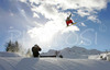 Snowboarders and freestyle skiers performing freestyle skiing tricks during opening of Snowboard park Elan on Vogel, Slovenia
