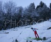 Arhur Pauli of Austria leaving inrun through the air during Individual ski jumping race of FIS Nordic Junior Ski World Championships, which was held in Kranj, Slovenia. Race was won by Gregor Schlierenzauner of Austria, Jurij Tepes of Slovenia placed second, while Andrea Morassi of Italy placed third.
