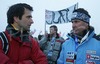 Former Ski jumping World Champion Franci Petek of Slovenia (L) in discussion with chief of Slovene Nordic Skiing and also former ski jumper and winner of several World cup races Primoz Ulaga of Slovenia (R), while fans of second placed Jurij Tepes of Slovenia celebrating in background after Individual ski jumping race of FIS Nordic Junior Ski World Championships, which was held in Kranj, Slovenia. Race was won by Gregor Schlierenzauner of Austria, Jurij Tepes of Slovenia placed second, while Andrea Morassi of Italy placed third.
