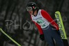 Mike Glasder of USA soars through the air during Junior ski jumping team race of FIS Nordic Junior Ski World Championships. Race was won by Austria, Slovenia placed second, while Japan finished third.
