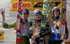 Winner Jakub Janda of Czech (M), second placed Janne Ahonen of Finland (L) and third placed Andreas Kuettel of Switzerland (R) celebrating their overall standing medals of e.on Ruhrgas FIS Ski Jumping World Cup after last race which was held in Planica, Slovenia on 19.March 2006.

