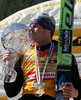 Overall World Cup winner Jakub Janda of Czech celebrating his victory with Overall world cup trophy after last race of e.on Ruhrgas FIS Ski Jumping World Cup which was held in Planica, Slovenia on 19.March 2006.
