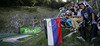 Jung ski jumpers who later skied down hill with flags of participating countries are watching their idols  flying through the air during Summer FIS Grand Prix in ski jumping Kranj 2006. Summer FIS Grand Prix in ski jumping Kranj 2006 was held on 2. of September 2006 in Kranj, Slovenia.

