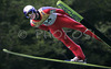 Two time Olympic champion from Torino 2006 Thomas Morgenstern of Austria soars through the air during Summer FIS Grand Prix in ski jumping Kranj 2006. Summer FIS Grand Prix in ski jumping Kranj 2006 was held on 2. of September 2006 in Kranj, Slovenia.
