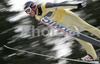 Leader after ski jumping Christoph Bieler of Austria soars through the air during first jump of FIS Nordic Combined World Cup, which was held in Ramsau am Dachstein, Austria, on 17th of December 2006.
