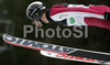 Magnus-H. Moan of Norway soars through the air during first jump of FIS Nordic Combined World Cup, which was held in Ramsau am Dachstein, Austria, on 17th of December 2006.
