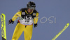 Jaakko Tallus of Finland soars through the air during ski jumping part of Nordic Combined World Cup. Nordic combined World Cup was held in Ramsau, Austria on 15th of December 2007.

