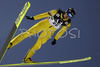 Janne Ryynaenen of Finland soars through the air during ski jumping part of Nordic Combined World Cup. Nordic combined World Cup was held in Ramsau, Austria on 15th of December 2007.
