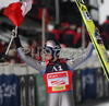 Winner Thomas Morgenstern of Austria celebrates his victory in FIS Ski jumping World Cup race in Villach, Austria. First of two ski jumping World Cup races in Villach, Austria was held on 13th of December 2007, as substitute race for canceled race in Kranj, Slovenia
