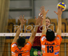 Kay Van Dijk of Nolik Maaseik (M) spikes over Jasmin Cuturic of ACH Volley Bled (L) and Matevz Kamnik of ACH Volley Bled (R) during match of Volleyball Indesit European Champions League between ACH Volley Bled, Slovenia and Noliko Maaseik, Belgium. Match of first round of Volleyball Indesit European Champions League, group F, was played in Tivoli Arena in Ljubljana, Slovenia on 17th of October 2007. Match was won by ACH Volley Bled, who defeated Noliko Maaseik with 3-1.

