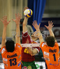 Antti Siltala of Nolik Maaseik (M) spikes between Matevz Kamnik of ACH Volley Bled (L) and Tine Urnaut of ACH Volley Bled (R) during match of Volleyball Indesit European Champions League between ACH Volley Bled, Slovenia and Noliko Maaseik, Belgium. Match of first round of Volleyball Indesit European Champions League, group F, was played in Tivoli Arena in Ljubljana, Slovenia on 17th of October 2007. Match was won by ACH Volley Bled, who defeated Noliko Maaseik with 3-1.
