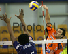 Mitja Gasparini (no.6) of ACH Volley (R) spikes over Ludovic Castard (no.15) of Paris Volley (L) during match of 3rd round of Indesit European Champions League between ACH Volley, Bled, Slovenia and Paris Volley, France. Match was played in Tivoli arena, Ljubljana, Slovenia on 12th of December 2007. 

