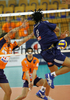 Romain Vadeleux (no.9) of Paris Volley (R) spikes when Scott Joseph Touzinsky (no.7) of ACH Volley (L) an Mitja Gasparini (no.6) of ACH Volley (M) are trying to block him during match of 3rd round of Indesit European Champions League between ACH Volley, Bled, Slovenia and Paris Volley, France. Match was played in Tivoli arena, Ljubljana, Slovenia on 12th of December 2007. 
