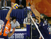 Jasmin Cuturic (no.8) of ACH Volley (L) spikes over block of Paris Volley during match of 3rd round of Indesit European Champions League between ACH Volley, Bled, Slovenia and Paris Volley, France. Match was played in Tivoli arena, Ljubljana, Slovenia on 12th of December 2007. 

