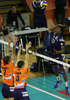 Ludovic Castard (no.15) of Paris Volley (R) spikes over block of Scott Joseph Touzinsky (no.7) of ACH Volley (L) and Davor Cebron (no.3) of ACH Volley (M) during match of 3rd round of Indesit European Champions League between ACH Volley, Bled, Slovenia and Paris Volley, France. Match was played in Tivoli arena, Ljubljana, Slovenia on 12th of December 2007. 

