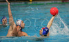 Boban Antonijevic of Slovenia (L) is trying to hinder Frederic Audon of France (R) when he is trying to shoot on goal during first match of qualification waterpolo tournament for European championship. Match between Slovenia and France took place in Kranj, Slovenia on 7.April 2006. Slovenia defeated France with 9:7.

