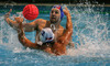 Frederic Audon of France (blue cap) is fighting for ball with Tomas Bruder of Slovakia (white cap) during match of qualification waterpolo tournament for European championship between France and Slovakia. Match between France and Slovakia  took place in Kranj, Slovenia on 8.April 2006. Slovakia defeated France with 11-10.
