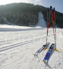 Cross country skis and poles left next to skiing track in Ratece, Slovenia. Lot of cross country skiers came to Ratece to enjoy perfect conditions, which were made possible by low temperatures and sunny winter day.
