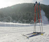Cross country skis and poles left next to skiing track in Ratece, Slovenia. Lot of cross country skiers came to Ratece to enjoy perfect conditions, which were made possible by low temperatures and sunny winter day.
