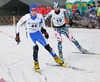 Kaarel Piho of Estonia (L) and Ville Tuppurainen of Finland (R) skiing during Junior Nordic Combined 10km pursuit race of FIS Nordic Junior Ski World Championship in Medvode, Slovenia.  Race was won by Francois Braud of France, Tom Beetz of Germany placed second, while Miroslav Dvorak of Czech finished third.
