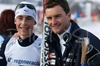 Winner Francois Braud of France (L) and his trainer (R) celebrating Brauds title of Junior World Champion on the end of Junior Nordic Combined 10km pursuit race of FIS Nordic Junior Ski World Championship in Medvode, Slovenia.  Race was won by Francois Braud of France, Tom Beetz of Germany placed second, while Miroslav Dvorak of Czech finished third.
