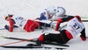 Joakim Aakvik of Norway (L), Martin Skopek of Czech (M) and Alfred Rainer of Austria (R) resting exhausted after Junior Nordic Combined 10km pursuit race of FIS Nordic Junior Ski World Championship in Medvode, Slovenia.  Race was won by Francois Braud of France, Tom Beetz of Germany placed second, while Miroslav Dvorak of Czech finished third.
