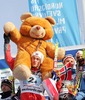 Petter Northug of Norway with his bear celebrating his fourth gold medal in Junior Men FIS Nordic Junior Ski World Championships 4x5km relay race which was held in Medvode,  Slovenia.
