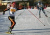 Winner Tom Beetz is celebrating his gold medal and crosses finish line of Junior Nordic Combined sprint race of FIS Nordic Junior Ski World Championships which was held in Medvode, Slovenia on 5.February 2006.
