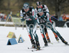 Ville Kaehkoenen of Finland, Jaakko Tallus of Finland, and Bernhard Gruber of Austria skiing during second race of FIS Nordic Combined World Cup in Ramsau. FIS Nordic Combined World Cup was held in Ramsau am Dachstein, Austria, on 17th of December 2006.
