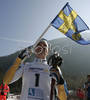 Winner Charlotte Kalla of Sweden celebrating her medal and World Champion title won in Women 5+5km pursuit race of Junior Nordic skiing World Championships in Tarvisio, Italy. Women 5+5km pursuit race of Junior Nordic skiing World Championships in Tarvisio, Italy was held on 16th of March 2007 in Fusine, Italy. Due warm weather and lack of snow, cross country skiing races of Junior Nordic skiing World Championships 2007 were moved from Tarvisio, Italy to Fusine, Italy.
