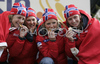 Wining team of Norway with members Celine Brun-Lie, Therese Johaug, Marte Monrad-Hansen and Astrid Jacobsen celebrating their medals won in Women 4x3.3km relay race of Junior Nordic skiing World Championships in Tarvisio, Italy. Women 4x3.3km relay race of Junior Nordic skiing World Championships in Tarvisio, Italy was held on 18th of March 2007 in Fusine, Italy. Due warm weather and lack of snow, cross country skiing races of Junior Nordic skiing World Championships 2007 were moved from Tarvisio, Italy to Fusine, Italy.
