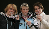 Winner Eric Frenzel of Germany (M), second placed Anssi Koivuranta of Finland (L) and third placed Alfred Reiner of Austria (R) celebrating their medals won in Nordic combined sprint race of Junior Nordic skiing World Championships in Tarvisio, Italy. Nordic combined sprint race of Junior Nordic skiing World Championships in Tarvisio, Italy was held on 18th of March 2007 in Fusine, Italy. Due warm weather and lack of snow, cross country skiing races of Junior Nordic skiing World Championships 2007 were moved from Tarvisio, Italy to Fusine, Italy.
