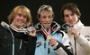 Winner Eric Frenzel of Germany (M), second placed Anssi Koivuranta of Finland (L) and third placed Alfred Reiner of Austria (R) celebrating their medals won in Nordic combined sprint race of Junior Nordic skiing World Championships in Tarvisio, Italy. Nordic combined sprint race of Junior Nordic skiing World Championships in Tarvisio, Italy was held on 18th of March 2007 in Fusine, Italy. Due warm weather and lack of snow, cross country skiing races of Junior Nordic skiing World Championships 2007 were moved from Tarvisio, Italy to Fusine, Italy.
