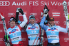 From left second placed Carlo Janka of Switzerland, winner Aksel Lund Svindal of Norway and third placed Patrick Staudacher of Italy celebrate on the podium after the mens alpine ski World Cup Super-G race in Val Gardena, Italy, Friday, December 18, 2009.
