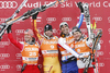 From left second placed Mario Scheiber of Austria, winner Manuel Osborne-Paradis of Canada, third placed ex-aequo Johan Clarey of France and Ambrosi Hoffmann of Switzerland celebrate on the podium after the after the mens alpine ski World Cup Downhill race in Val Gardena, Italy, Saturday, December 19, 2009.
