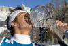 Massimiliano Blardone of Italy kisses the trophy in the finish area after winning the mens alpine ski World Cup Giant Slalom race in Alta Badia, Italy, Sunday, December 20, 2009.33
