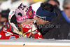 Janica Kostelic of Croatia, left, with an unidentified man during the mens alpine ski World Cup Giant Slalom race in Alta Badia, Italy, Sunday, December 20, 2009.
