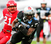 Ranta Sampo, (Helsinki Roosters, DB, #21) and Jaycen Taylor Spears, (SWARCO Raiders Tirol, RB, #7) during quarterfinal match of European Football League between Swarco Raiders Tirol, Innsbruck, Austria, and Helsinki Roosters, Finland. Quarterfinal match of European Football League between Swarco Raiders Tirol and Helsinki Roosters was played on Saturday, 25th of May 2013 in Innsbruck, Austria.

