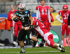 Damaso Tarneller  (SWARCO Raiders Tirol, WR, #3) and Mark De Swart (Helsinki Roosters, LB, #3) during quarterfinal match of European Football League between Swarco Raiders Tirol, Innsbruck, Austria, and Helsinki Roosters, Finland. Quarterfinal match of European Football League between Swarco Raiders Tirol and Helsinki Roosters was played on Saturday, 25th of May 2013 in Innsbruck, Austria.
