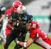 Ranta Sampo, (Helsinki Roosters, DB, #21), Jaycen Taylor Spears, (SWARCO Raiders Tirol, RB, #7) and Stephen Peyton, (Helsinki Roosters, DB, #30) during quarterfinal match of European Football League between Swarco Raiders Tirol, Innsbruck, Austria, and Helsinki Roosters, Finland. Quarterfinal match of European Football League between Swarco Raiders Tirol and Helsinki Roosters was played on Saturday, 25th of May 2013 in Innsbruck, Austria.
