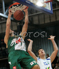 Hasan Rizvic (no.11) of Union Olimpija (L) dunks while Matej Krusic (no.12) of Helios Domzale can just helplessly watch during final match of Spar Cup 2007-08 between Union Olimpija, Ljubljana, Slovenia, and Helios Domzale, Slovenia. Match between Union Olimpija and Helios Domzale was played on 10th of February 2008 in Arena Kodeljevo in Ljubljana, Slovenia. Match and Cup was won by Union Olimpija, who defeated Helios Domzale in final match with 85:66.
