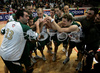 Players of Union Olimpija celebrating victory after end of final match of Spar Cup 2007-08 between Union Olimpija, Ljubljana, Slovenia, and Helios Domzale, Slovenia. Match between Union Olimpija and Helios Domzale was played on 10th of February 2008 in Arena Kodeljevo in Ljubljana, Slovenia. Match and Cup was won by Union Olimpija, who defeated Helios Domzale in final match with 85:66.
