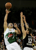 Marko Milic (no.12) of Union Olimpija (L) shooting over Novica Velickovic (no.12) of KK Partizan Igokea (R) during second half finals match of Basketball NLB League final four between Union Olimpija, Ljubljana, Slovenia and Partizan Beograd, Serbia. Match between Union Olimpija and Partizan Begrad was played on 25th of April 2008 in Tivoli Arena in Ljubljana, Slovenia. Match was won by Partizan, who defeated Union Olimpija with 94:90.
