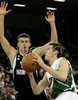 Goran Dragic (no.9) of Union Olimpija (R) attacking next to Novica Velickovic (no.12) of KK Partizan Igokea (L) during second half finals match of Basketball NLB League final four between Union Olimpija, Ljubljana, Slovenia and Partizan Beograd, Serbia. Match between Union Olimpija and Partizan Begrad was played on 25th of April 2008 in Tivoli Arena in Ljubljana, Slovenia. Match was won by Partizan, who defeated Union Olimpija with 94:90.
