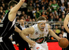 Miha Zupan (no.24) of Union Olimpija (R) and Novica Velickovic (no.12) of KK Partizan Igokea (L) during second half finals match of Basketball NLB League final four between Union Olimpija, Ljubljana, Slovenia and Partizan Beograd, Serbia. Match between Union Olimpija and Partizan Begrad was played on 25th of April 2008 in Tivoli Arena in Ljubljana, Slovenia. Match was won by Partizan, who defeated Union Olimpija with 94:90.
