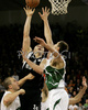 Nikola Pekovic (no.14) of KK Partizan Igokea (M) shooting over Hasan Rizvic (no.11) of Union Olimpija (R) during second half finals match of Basketball NLB League final four between Union Olimpija, Ljubljana, Slovenia and Partizan Beograd, Serbia. Match between Union Olimpija and Partizan Begrad was played on 25th of April 2008 in Tivoli Arena in Ljubljana, Slovenia. Match was won by Partizan, who defeated Union Olimpija with 94:90.

