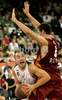 Marko Milic (no.12) of Union Olimpija (L) trying to score next to Angelo Gigli (no.6) of Lottomatica Roma (R) during match of Basketball Euroleague between Union Olimpija, Ljubljana, Slovenia and Lottomatica Roma, Italy. Match between Union Olimpija and Lottomatica Roma was played on 6th of November 2008 in Tivoli Arena in Ljubljana, Slovenia.
