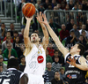 Saso Ozbolt (no.31) of Union Olimpija (M) shooting between Dragan Milosavljevic (no.12) of Partizan mts (R) and Nathan Jawai (no.15) of Partizan mts (L) during match of NLB Adriatic basketball League between Union Olimpija and Partizan. Match of NLB Adriatic basketball League between Union Olimpija, Ljubljana, Slovenia and Partizan, Belgrade, Serbia was played in Stozice Arena, Ljubljana, Slovenia, on Sunday, 31st of October 2010.
